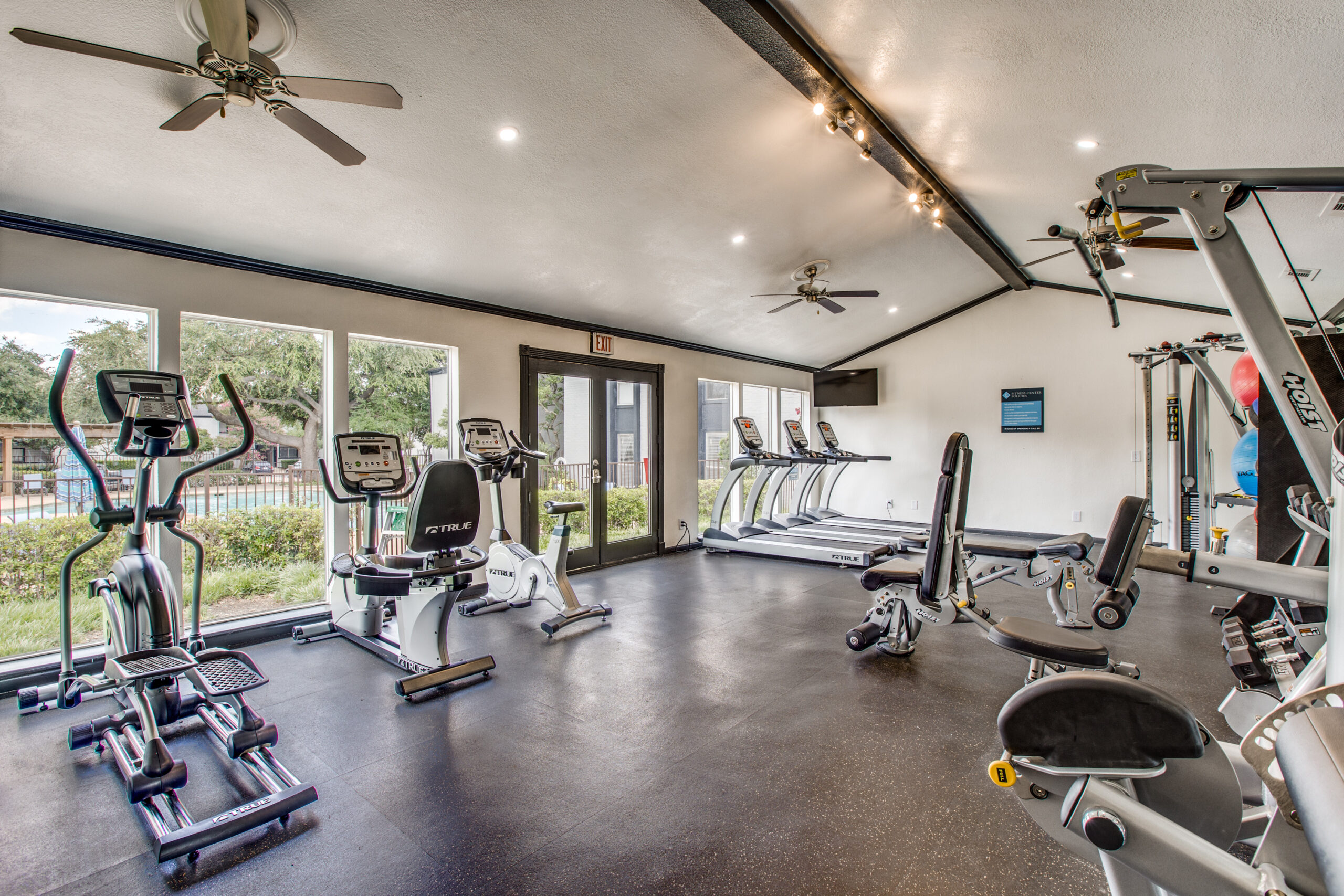 24-hour fitness center with pleny of workout equipment