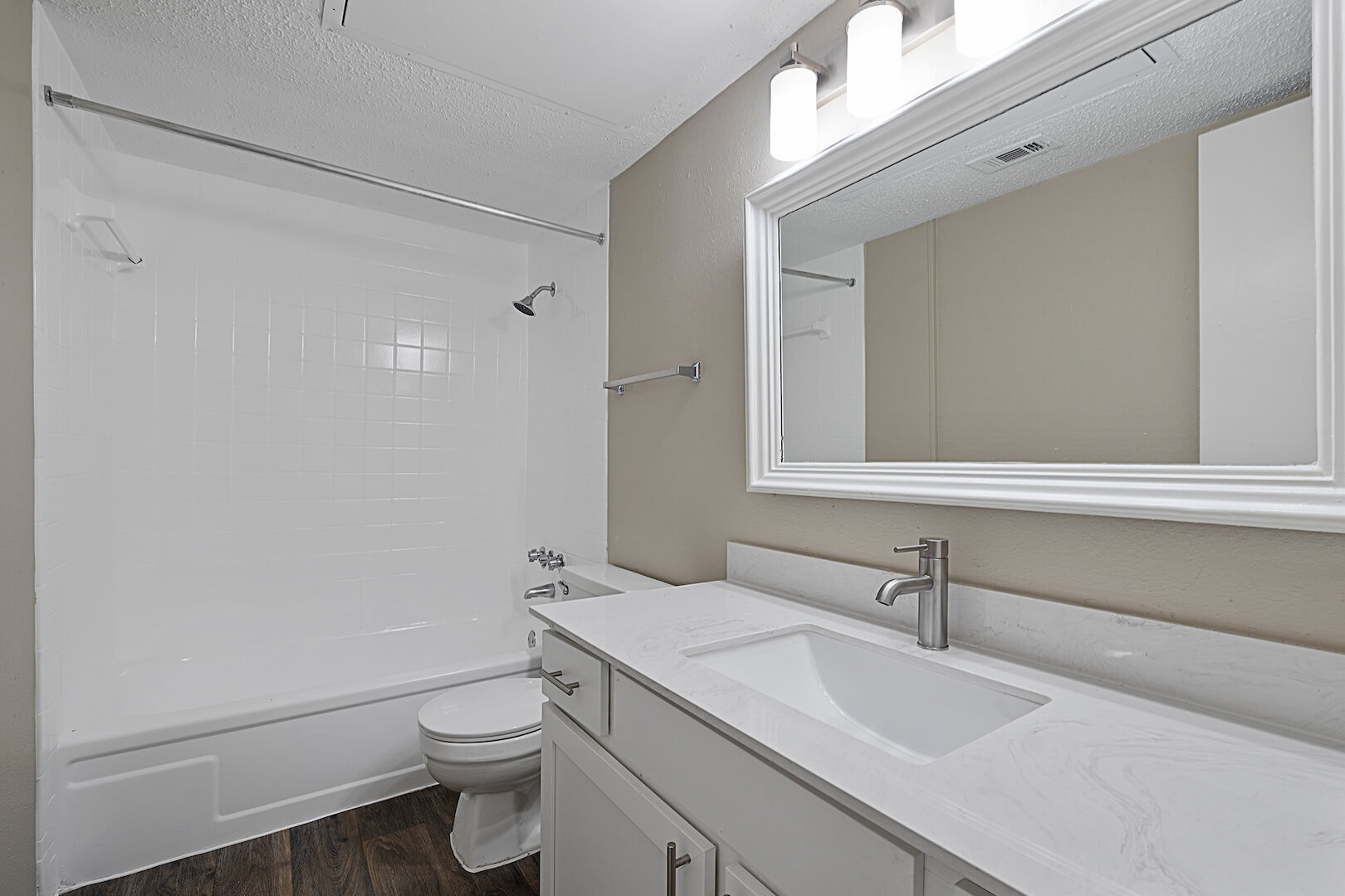 newly renovated bathrooms with vinyl wood-look flooring